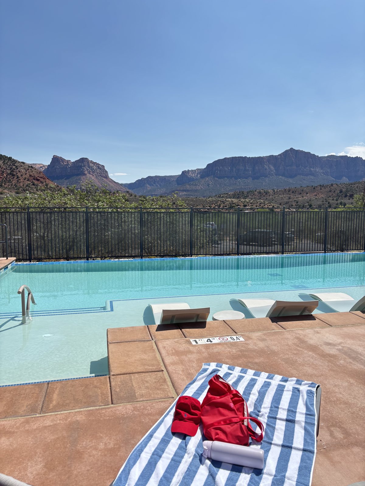 Hilton pool terrace with red rocks behind